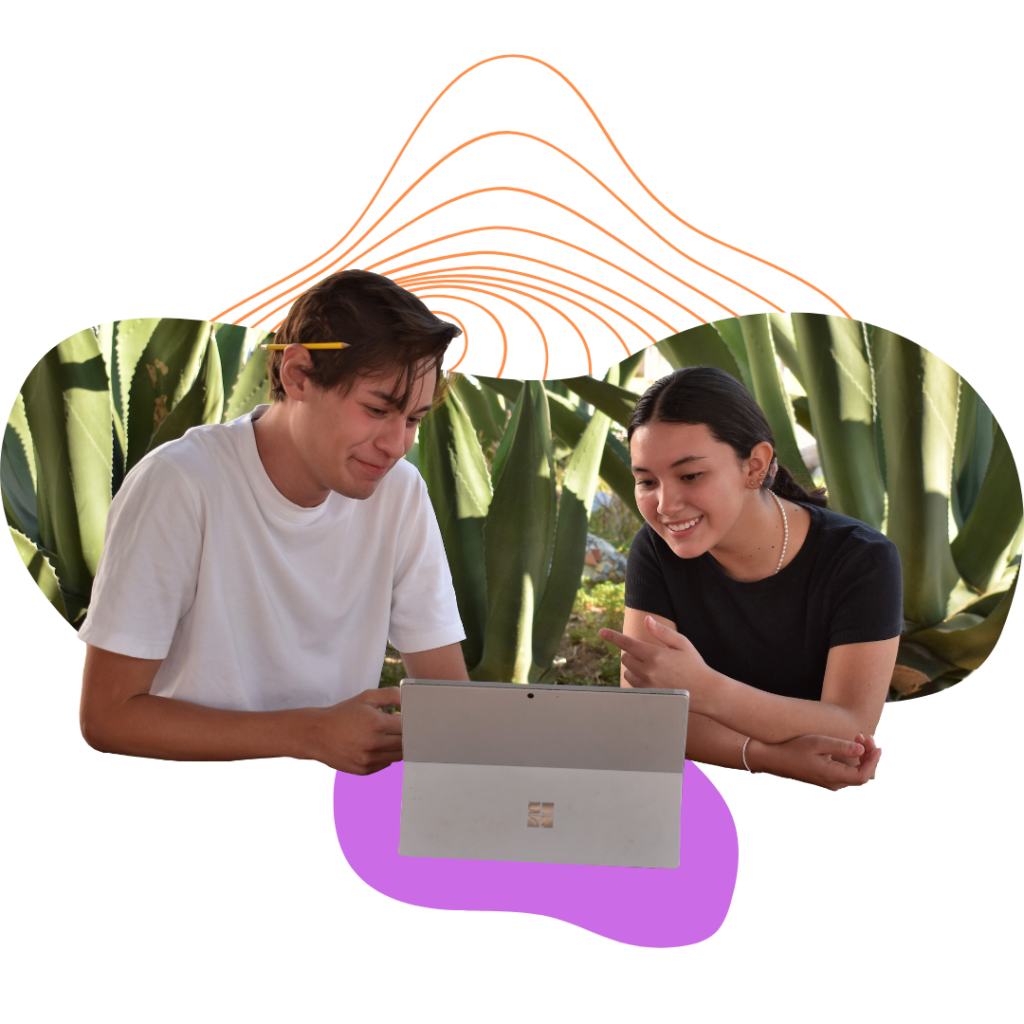 Two Victoria Prepa Online Students studying in front of Maguey plants